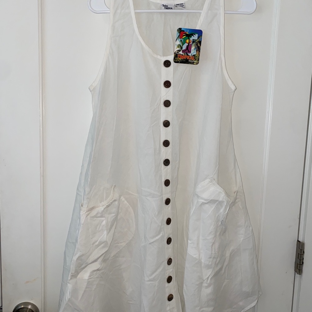 White beach cover up. Once size, would best fit small or medium